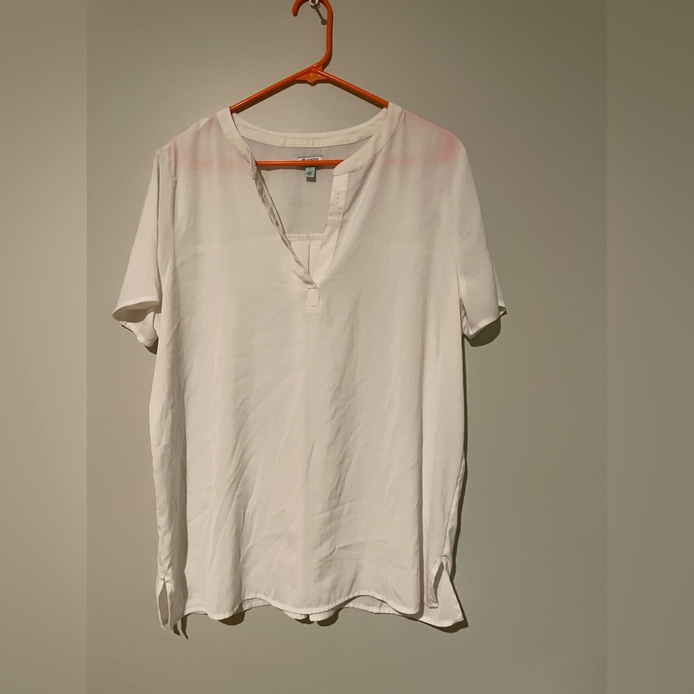 A beige shirt with buttons